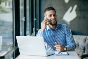 Developer on the phone helping a client